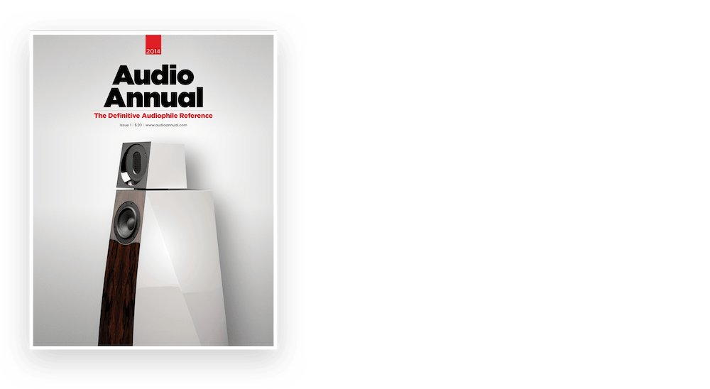 gray magazine cover with black text and a photo of speakers